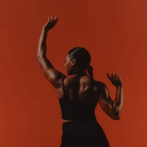 Athletic woman back reaching upwards
