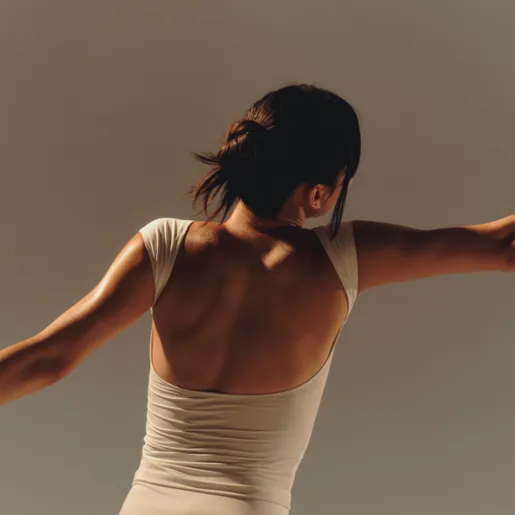 Behind woman in white stretching wide
