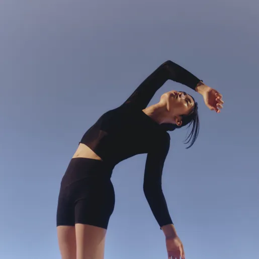 Slender woman leaning backwards